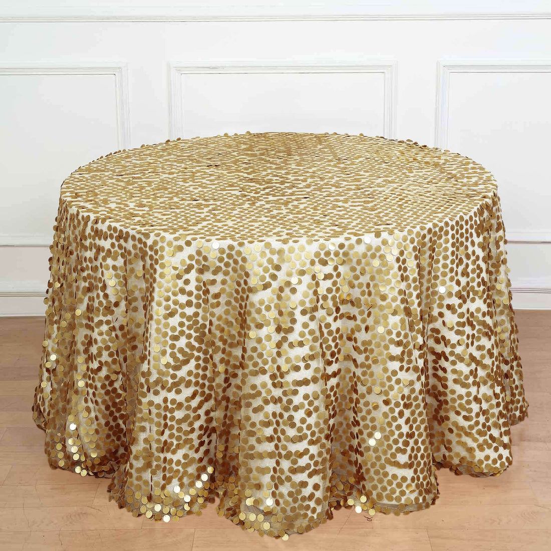 Gold sequin tablecloth with round shape and elegant design.