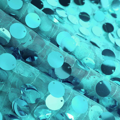 Blue sequin fabric with shiny circular discs for decorative use. #whtbkgd
