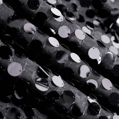 Black sequin fabric with textured dots for fashion and crafting projects. #whtbkgd
