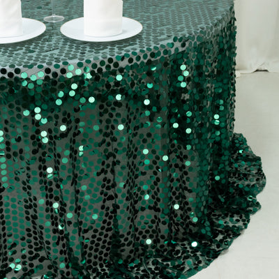 Green sequin tablecloth with a shimmering finish on a banquet table.