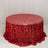 Red sequin tablecloth with a shimmering finish on a round table.