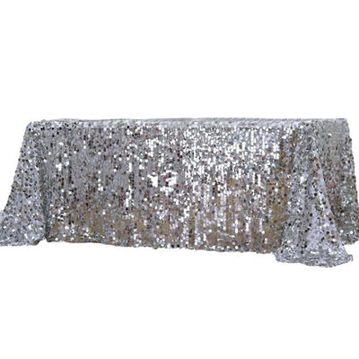 Silver sequin table cover with shimmering textures and elegant design.