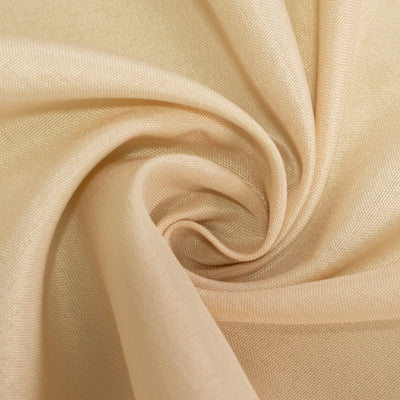 Light beige fabric swirl texture close-up shot.