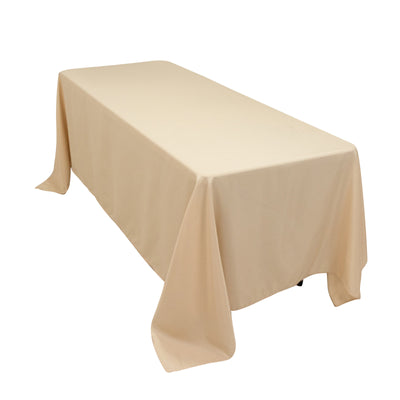 Beige tablecloth draped over a rectangular table