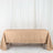 Beige tablecloth on a table against a neutral backdrop