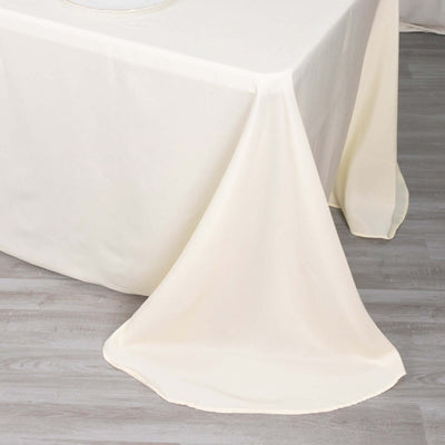 Ivory tablecloth draping elegantly over a table edge