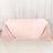 Pink tablecloth draped elegantly over a table in a studio setting.