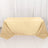 Beige tablecloth draped over a table on a plain backdrop.