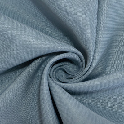 Textured blue fabric in a swirl pattern.