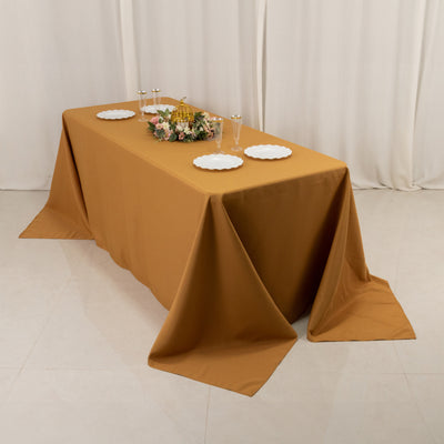 Brown tablecloth draped over a table set for a celebration.