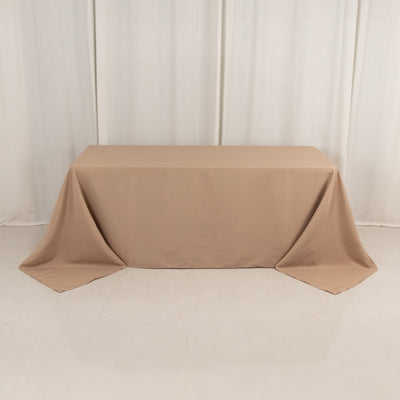 Beige tablecloth draped over a table in a studio setting