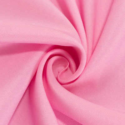 Pink fabric in a swirl pattern showcasing its smooth texture.
