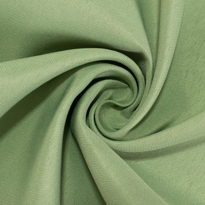 Green textured fabric in a spiral pattern.