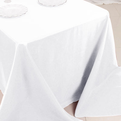 White tablecloth draped elegantly over a table.