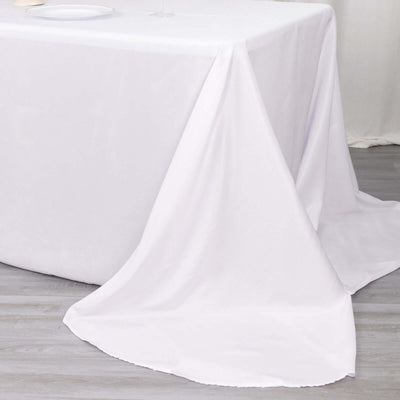 White tablecloth draping elegantly over a table surface.