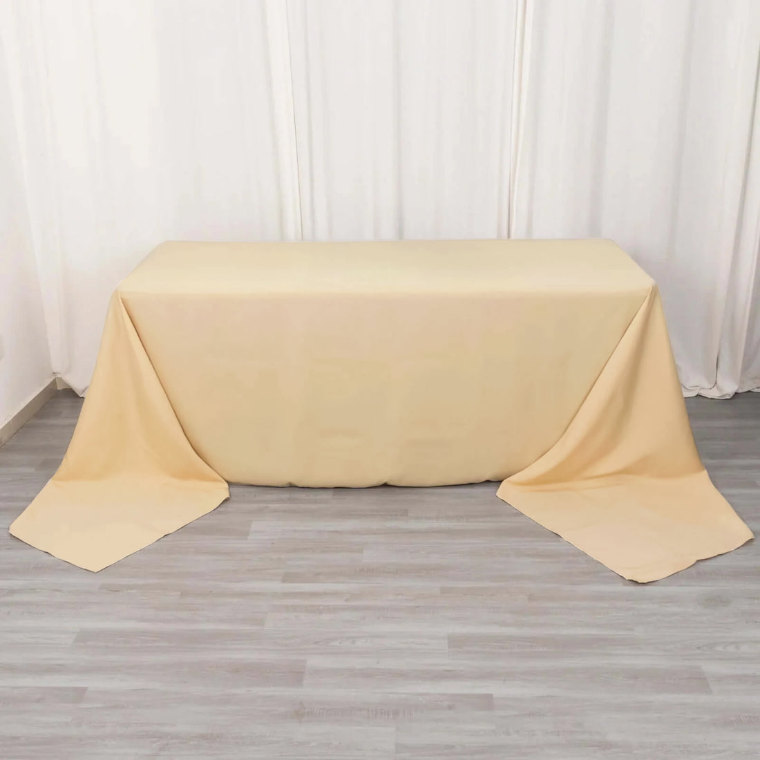 Beige table cover draped elegantly over a table.