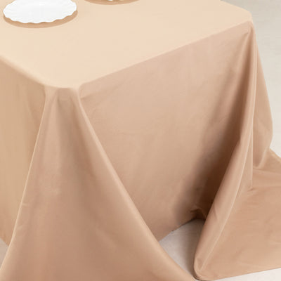 Beige tablecloth draped elegantly over a table.