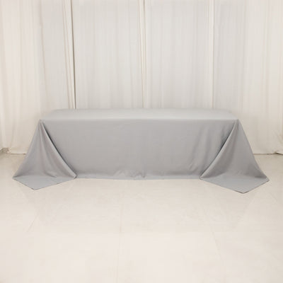 Gray tablecloth draped over a table in a studio setting