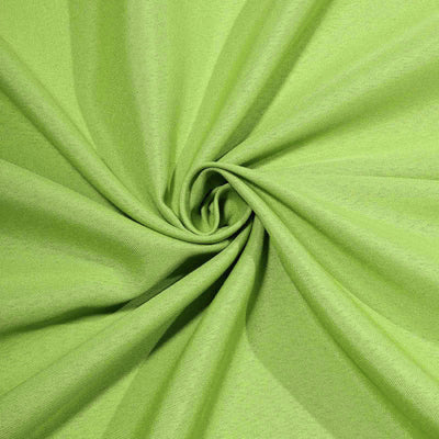 Vibrant green fabric texture in a swirling pattern.