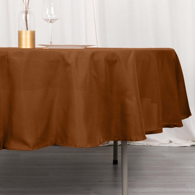 Brown tablecloth draped elegantly over a table in a staged dining setting.