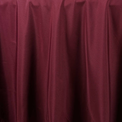 Burgundy tablecloth draped elegantly on a table.