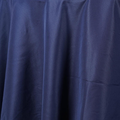 Navy blue satin fabric draped elegantly.