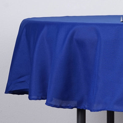 Blue tablecloth draped over a table, showcasing its smooth texture.