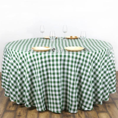Green and white checkered tablecloth on a round table setting
