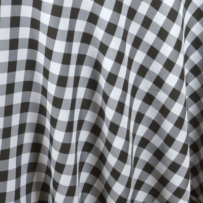 Black and white gingham pattern fabric draped elegantly.