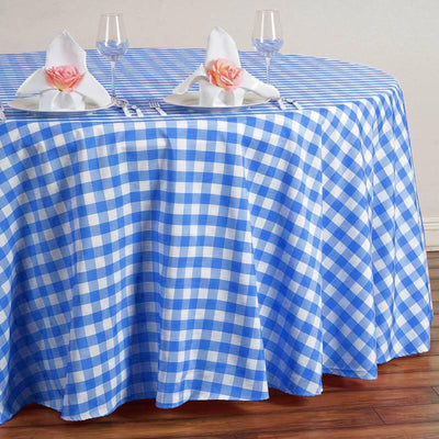 Blue and white checkered tablecloth on a round table set for dining.