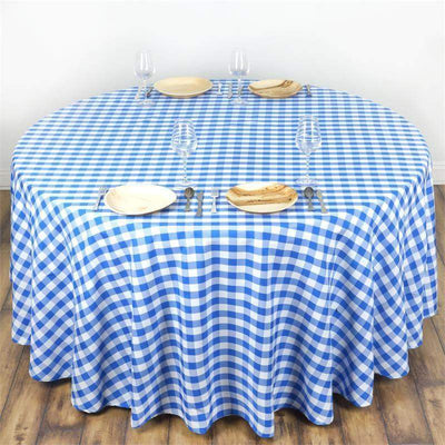 Round blue and white checkered tablecloth on a wooden table.