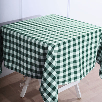 Green and white checkered tablecloth on a wooden table