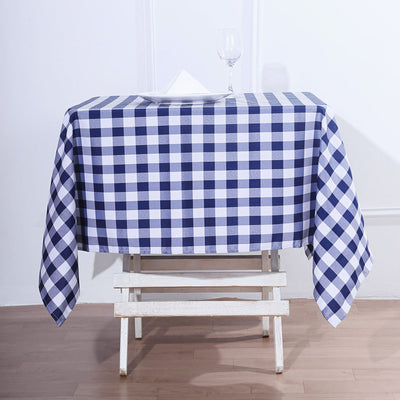 Blue and white checkered tablecloth draped over a simple table