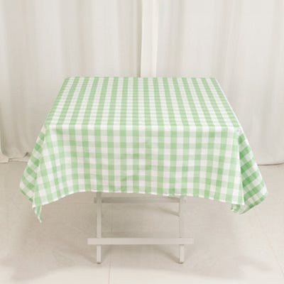 Green and white checkered tablecloth on a table.