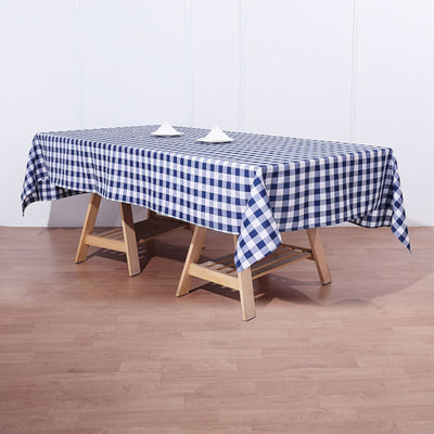 Navy and white checkered tablecloth on a wooden table.