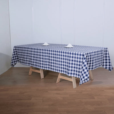 Navy and white checkered tablecloth on a wooden table
