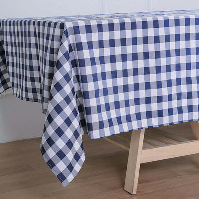 Navy and white checkered tablecloth draped over a wooden table.