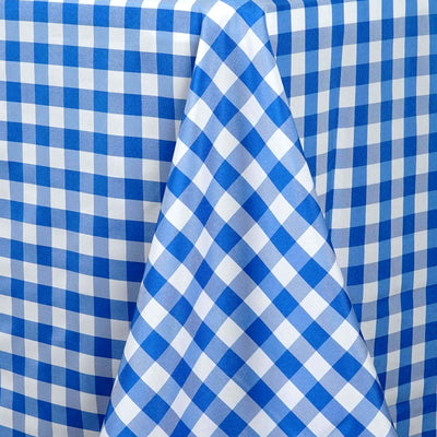 Blue and white checkered tablecloth with a draped corner.