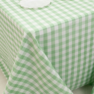 Green and white gingham tablecloth on a table.