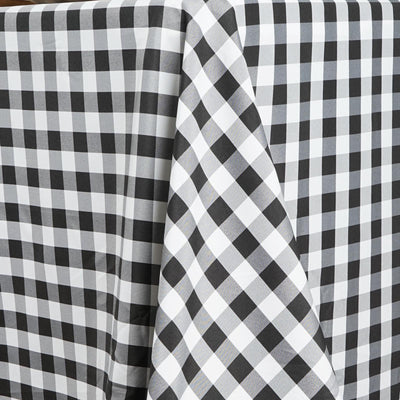 Black and white checkered tablecloth draped elegantly.