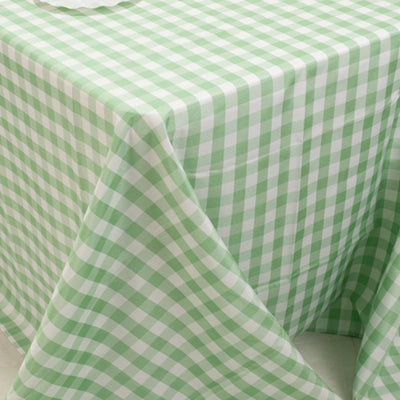 Green and white checkered tablecloth draped over a table.