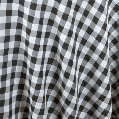 Black and white gingham fabric draping gracefully.