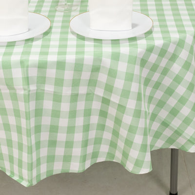 Green and white gingham tablecloth draped over a table.