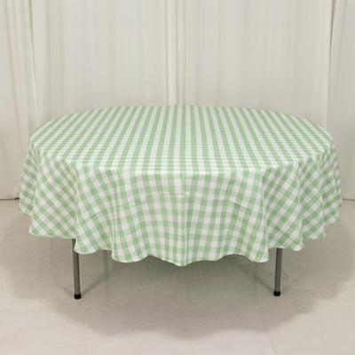 Green and white checkered tablecloth on an oval table