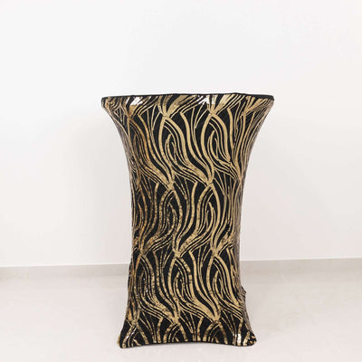Black and gold decorative table cover with elegant leaf pattern.