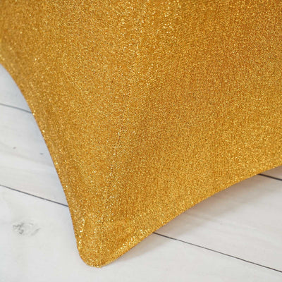 Shimmering gold fabric texture with a sparkling finish.