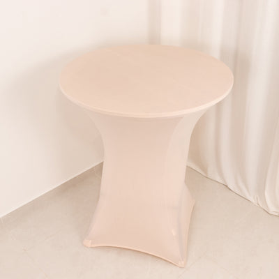 Round pedestal table with a sleek, modern design.