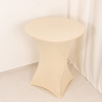 Beige accent table with a modern design on a plain background