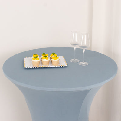 Dessert cupcakes with fruits on a table with two wine glasses