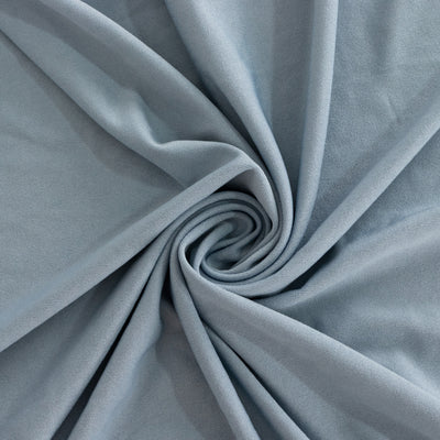Blue fabric texture in a swirling pattern.